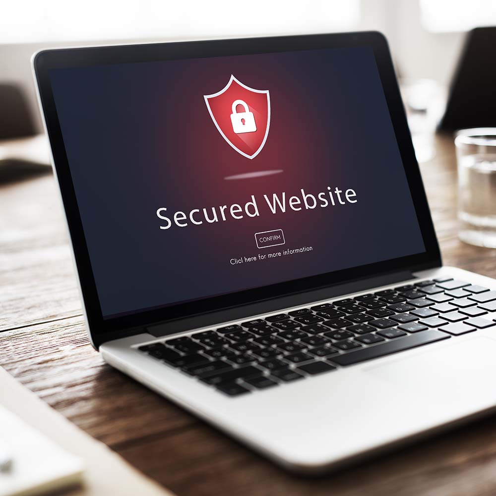 Laptop showing a red shield icon with a padlock in it and a "Secured Website" message, all on a black background.